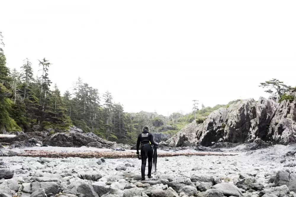 Jaidin Knighton walks out of the water after finishing snorkelling along the Wild Pacific Trail, in Ucluelet, on August 18, 2021.