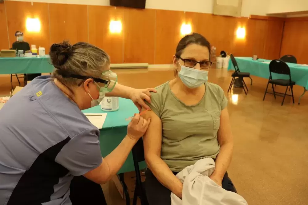 Hupacasath member Paulette Tatoosh receives her first COVID-19 shot, when NTC nurses brought Moderna doses to the House of Gathering on March 4, part of community immunization clinics being held across the province this month for on-reserve First Nations members. (Denise Titian photo) 