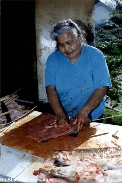 Ahousaht Elder, late Cecelia Titian, filling her smokehouse with dog salmon for her family’s winter stock.