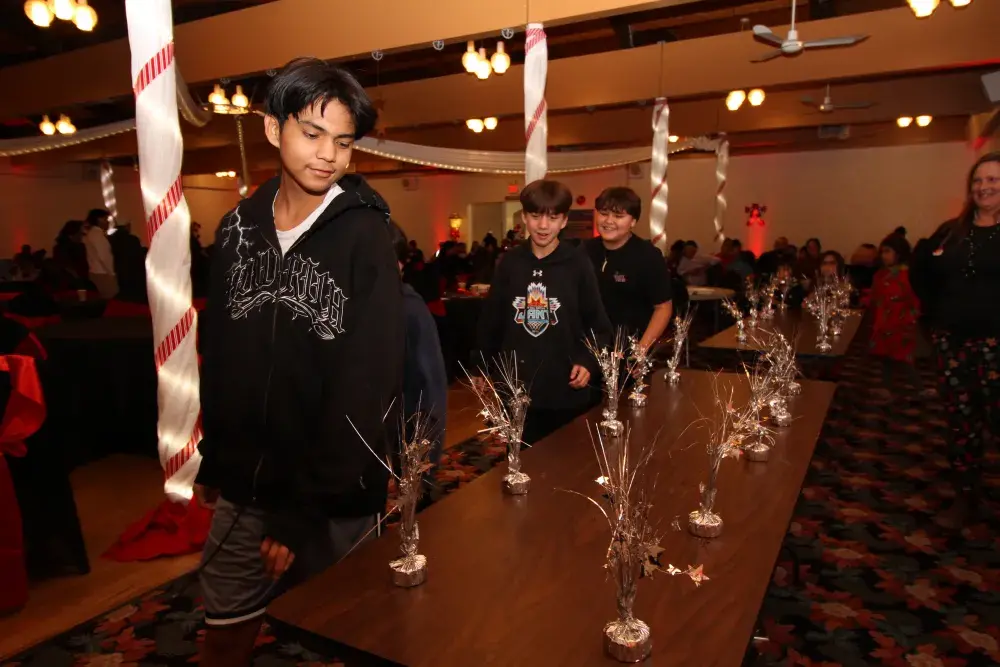 People of all ages played a games involving circling a table, then grabbing a silver object to get a prize when the music stopped.
