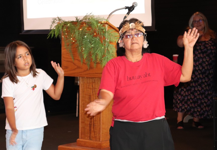 Huu-ay-aht dancers, including Colleen Peters in red, dance in celebration of Oomiiqsu Centre, which will open in the coming weeks.