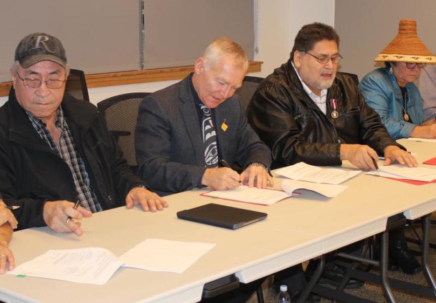Maa-nulth Treaty First Nations representatives sign 2018 treaty update with former MLA Scott Fraser, minister of Indigenous Relations and Reconciliation at the time. (HFN photo)