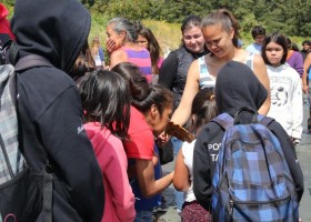 Cedar flags are handed out to the visiting kids 1