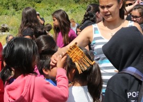 Cedar flags are handed out to the visiting kids