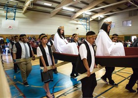 The girls are carried in the canoe by their guardians