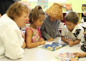 The Rotary Club of North Delta was critical to the development of the library. Dot with the Rotary reads with the kids.