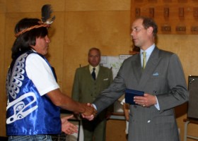 Hereditary Chief Paul Tate receives a gift from Prince Edward