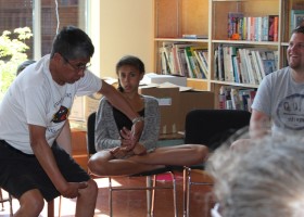 Sam Edgar demonstrates how he lifted a whale's tail in the storytelling session