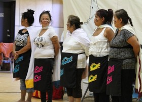 Dancers are gifted their aprons for dancing