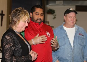 Kim Rai presents a cheque for $900-plus to Bread of Life administrator Cindy Sjoholm and cook Jim Steel