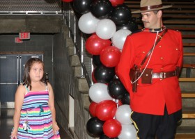 Young Neve steps in for her father in the grad introductions