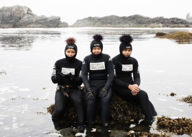 (From left to right) Kenneth Lucas, Brandi Lucas and Jaidin Knighton pose for a photo with sea urchins after snorkelling along the Wild Pacific Trail, in Ucluelet, on August 18, 2021.